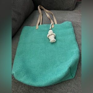 Green heavy duty jute bag with faux  leather straps. Like new.